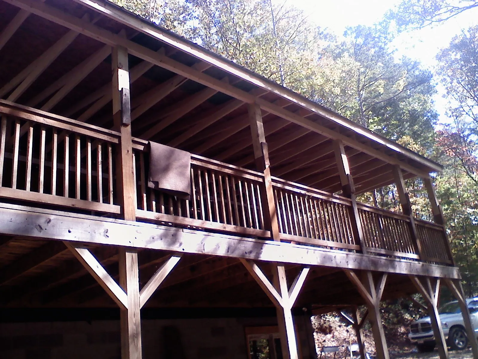 Timber framing under a new elevated porch and deck — Roof Leak Repair in Apulia Station by Roofing Brothers
